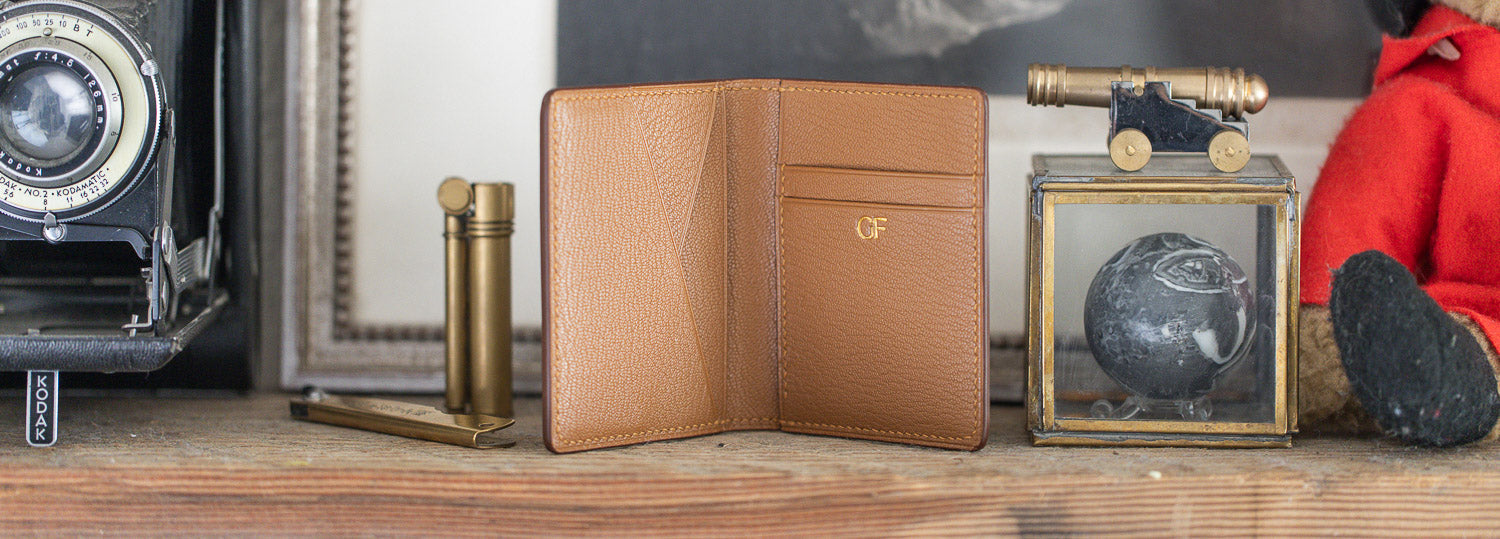A Gladfellow cordovan wallet sitting open on a shelf